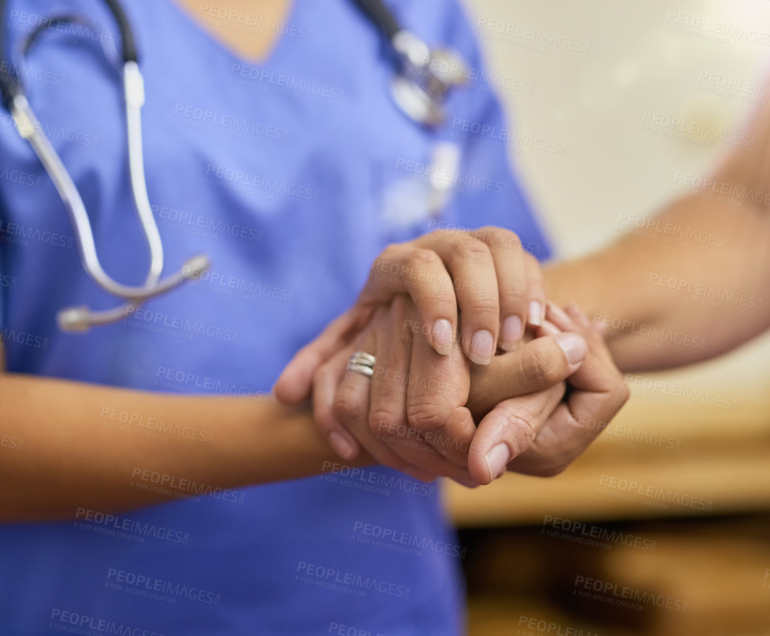 Buy stock photo Cropped shot of a nurse holding a senior woman's hands in comfort