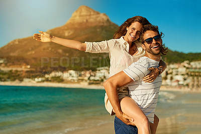 Buy stock photo Happy, piggyback and portrait with couple on beach together for anniversary, date or romance in summer. Love, smile or vacation with man and woman on tropical island paradise for honeymoon holiday