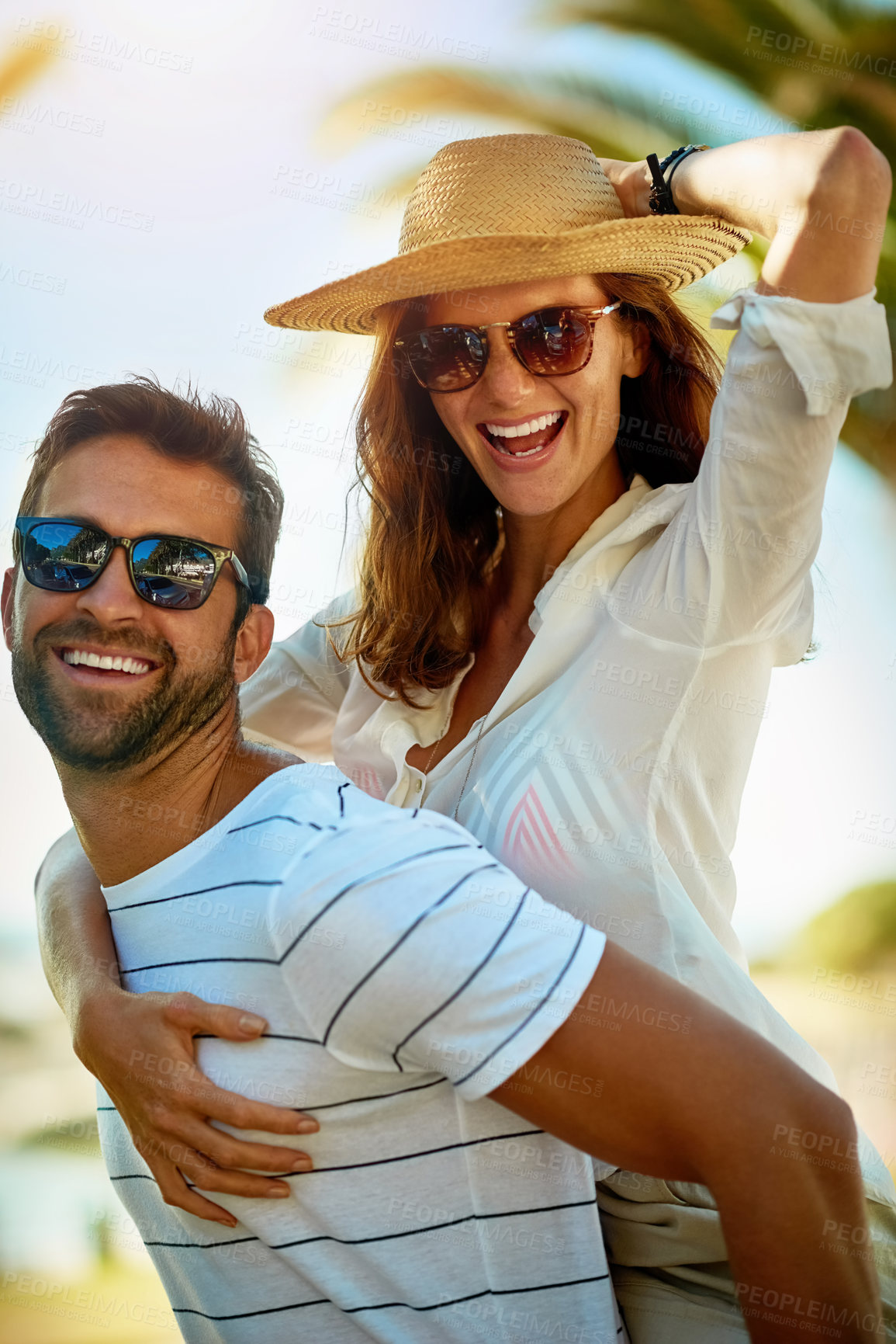 Buy stock photo Couple, piggyback and happy on portrait in outdoor with joy for summer holiday, bonding and fun in Spain. Relationship, people and smile with support on vacation, trip and travel together as soulmate