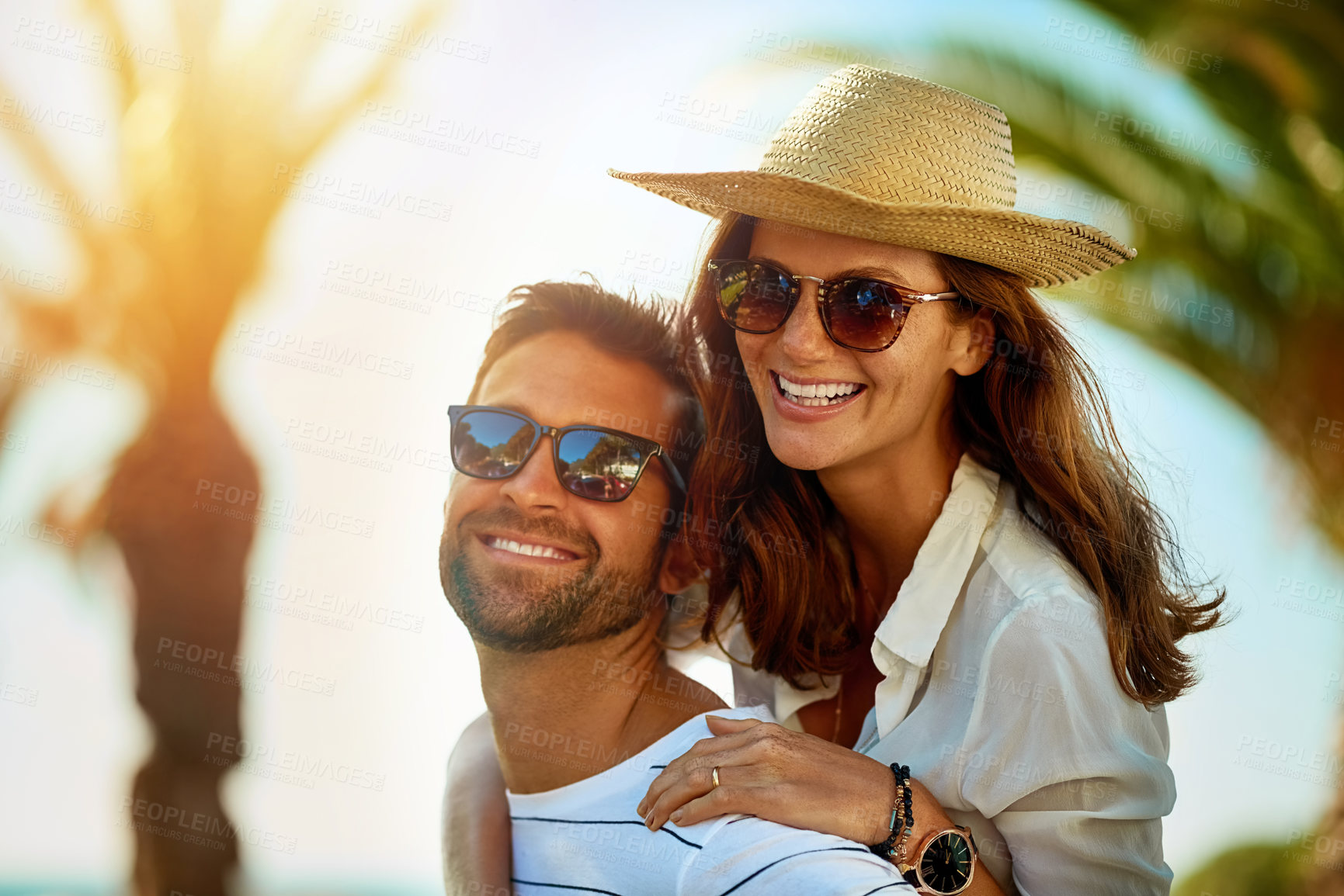 Buy stock photo Piggyback, portrait and smile with couple on beach together for anniversary, love or romance in summer. Date, travel or vacation with happy man and woman on tropical island paradise for honeymoon