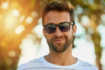 Buy stock photo Confidence, sunglasses and portrait of a man in a park while on a summer vacation, weekend trip or holiday. Smile, happy and face of a young male person from Brazil standing in an outdoor garden.