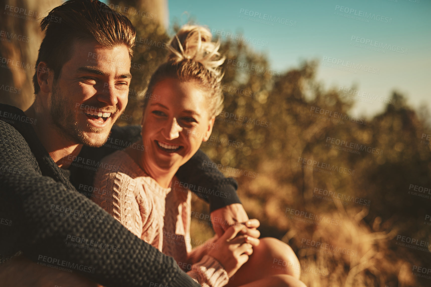 Buy stock photo Nature, sunset and couple on mountain hugging, laughing and bonding on romantic date for marriage connection. Happy, relax and young man and woman embracing with love on mountain in Switzerland.