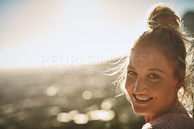 Buy stock photo Shot of a young woman spending the day outdoors
