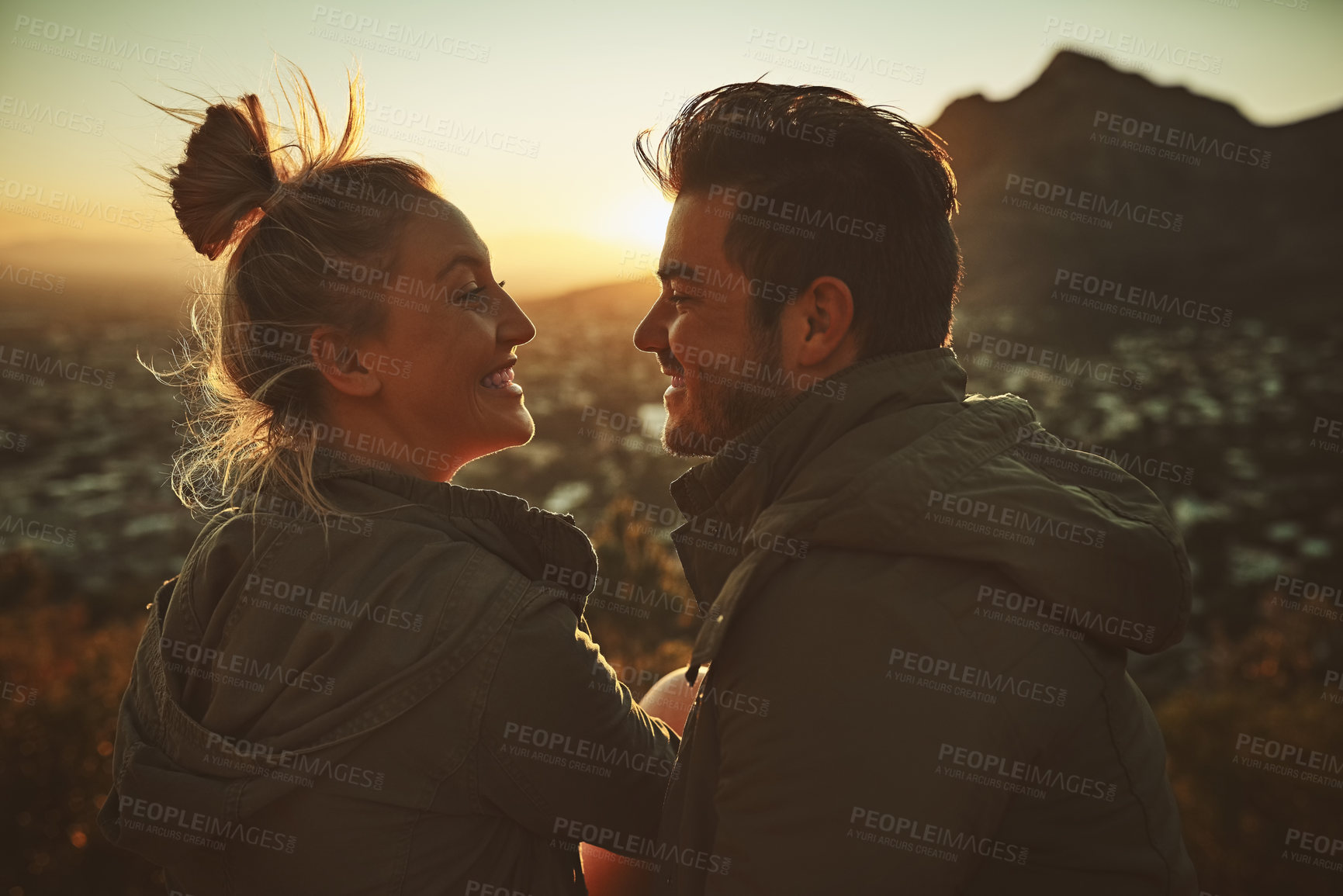 Buy stock photo Happy couple, together and adventure on mountain top for hiking and sunset with love. Man, woman and smile in nature for trekking, travel and support for date or location for holiday in Los Angeles