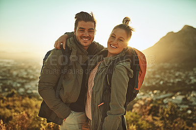 Buy stock photo Cropped shot of an affectionate couple standing on a mountain top