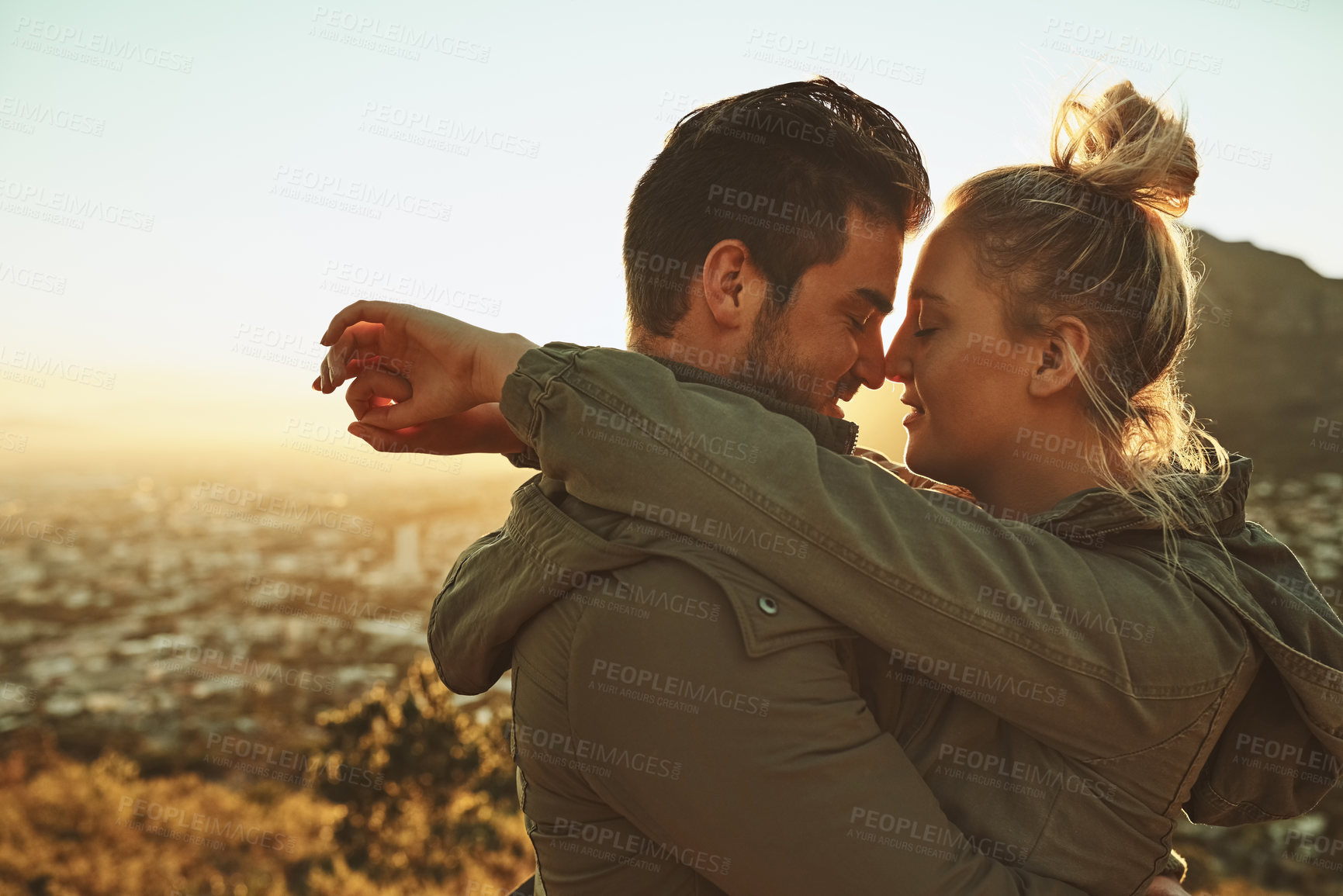 Buy stock photo kiss, couple and adventure on mountain top for hiking, date or vacation with love or hug. Man, woman and together in nature for trekking, travel and support or care in summer for holiday or wellness