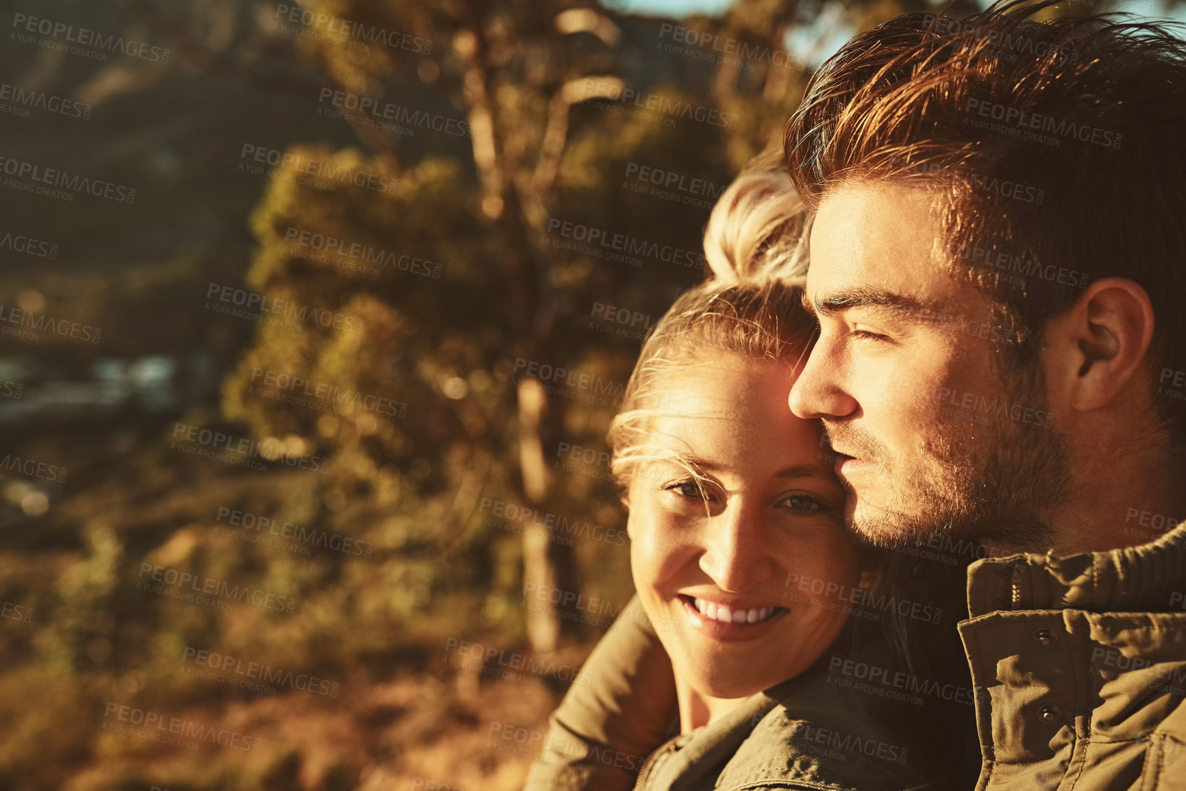 Buy stock photo Woods, sunset and portrait of couple hugging on romantic date for marriage connection in nature. Happy, relax and young man and woman embracing with love in forest in Switzerland for adventure.