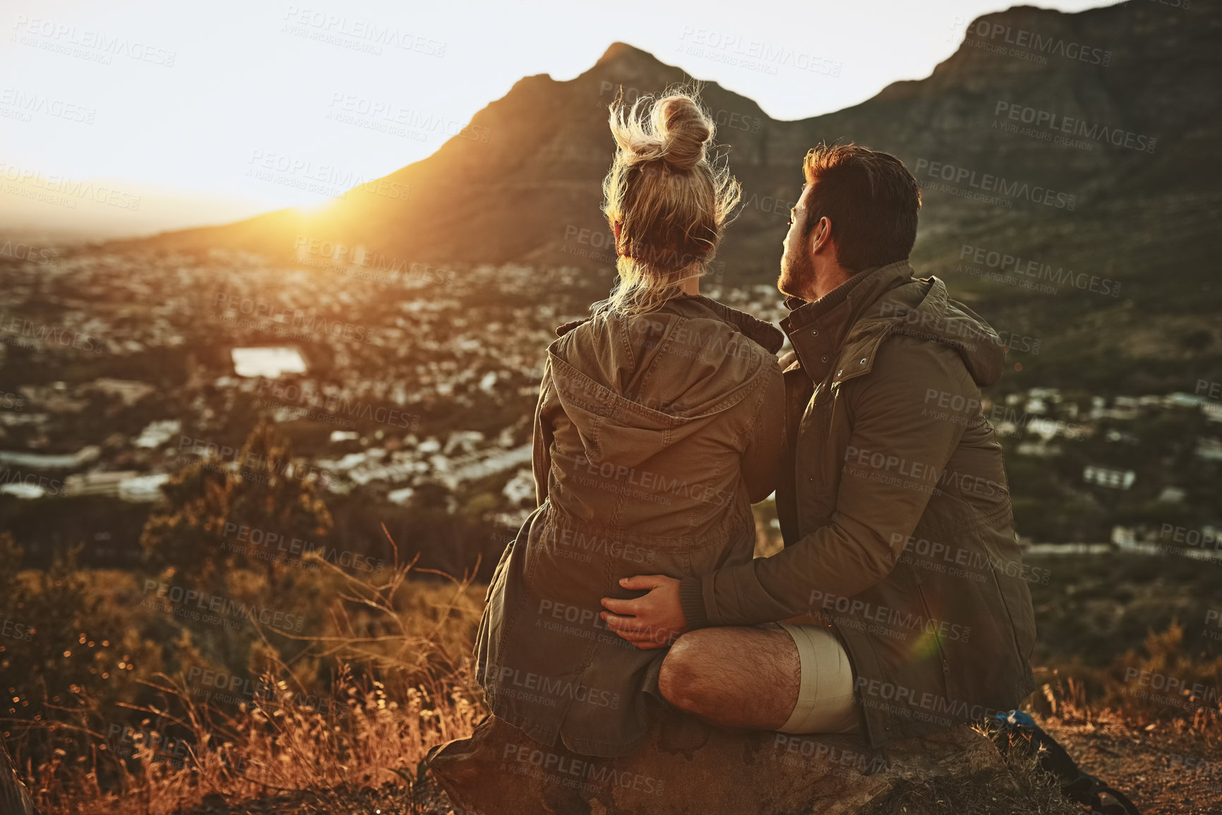 Buy stock photo Couple, hiking and sunrise on mountain with people for morning adventure, scenery and explore with bonding. Back, relax and trekking on expedition for sightseeing, love or together on cliff in nature