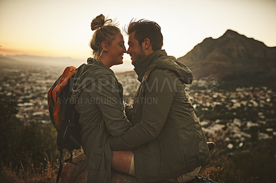 Buy stock photo Cropped shot of an affectionate couple on a mountain top