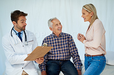 Buy stock photo Shot of a doctor sharing positive test results with a patient in his office