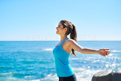 Buy stock photo Fitness, happy woman and freedom at ocean space with wellness, peace of mind and zen. Athlete girl, profile and smile at sea for fresh air, stretching and pride for healthy body achievement in nature