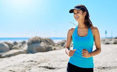 Buy stock photo Fitness, running and woman with cap, beach and activity for marathon, healthy and training in nature. Outdoor, athlete and person with sportswear, runner and smile for wellness, energy and sea