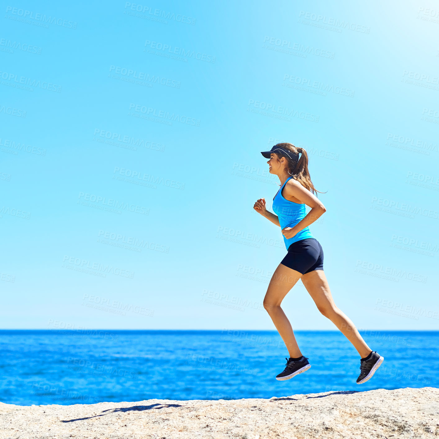 Buy stock photo Shot of a young woman out running