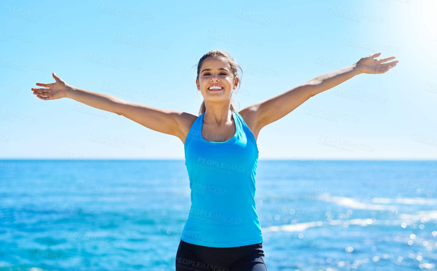 Buy stock photo Portrait, smile and woman at beach for freedom, summer workout or sports exercise with blue sky. Ocean, happy and female athlete at sea for wellness, fitness and training routine in Miami nature