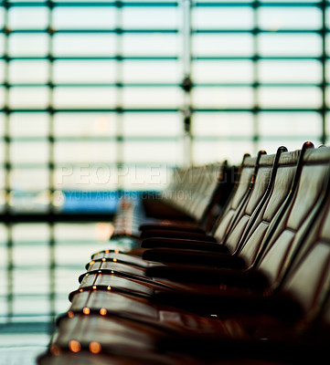 Buy stock photo Shot of rows of seats in an empty airport departure lounge