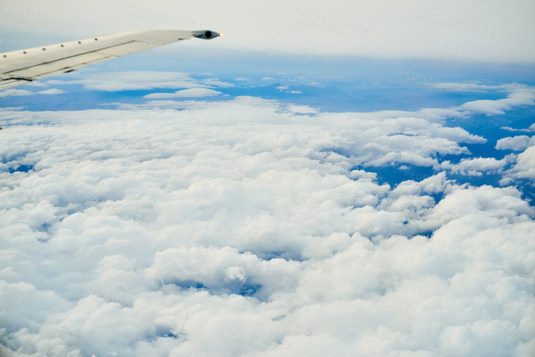 Buy stock photo Shot of a cloudy view seen from an airplane window