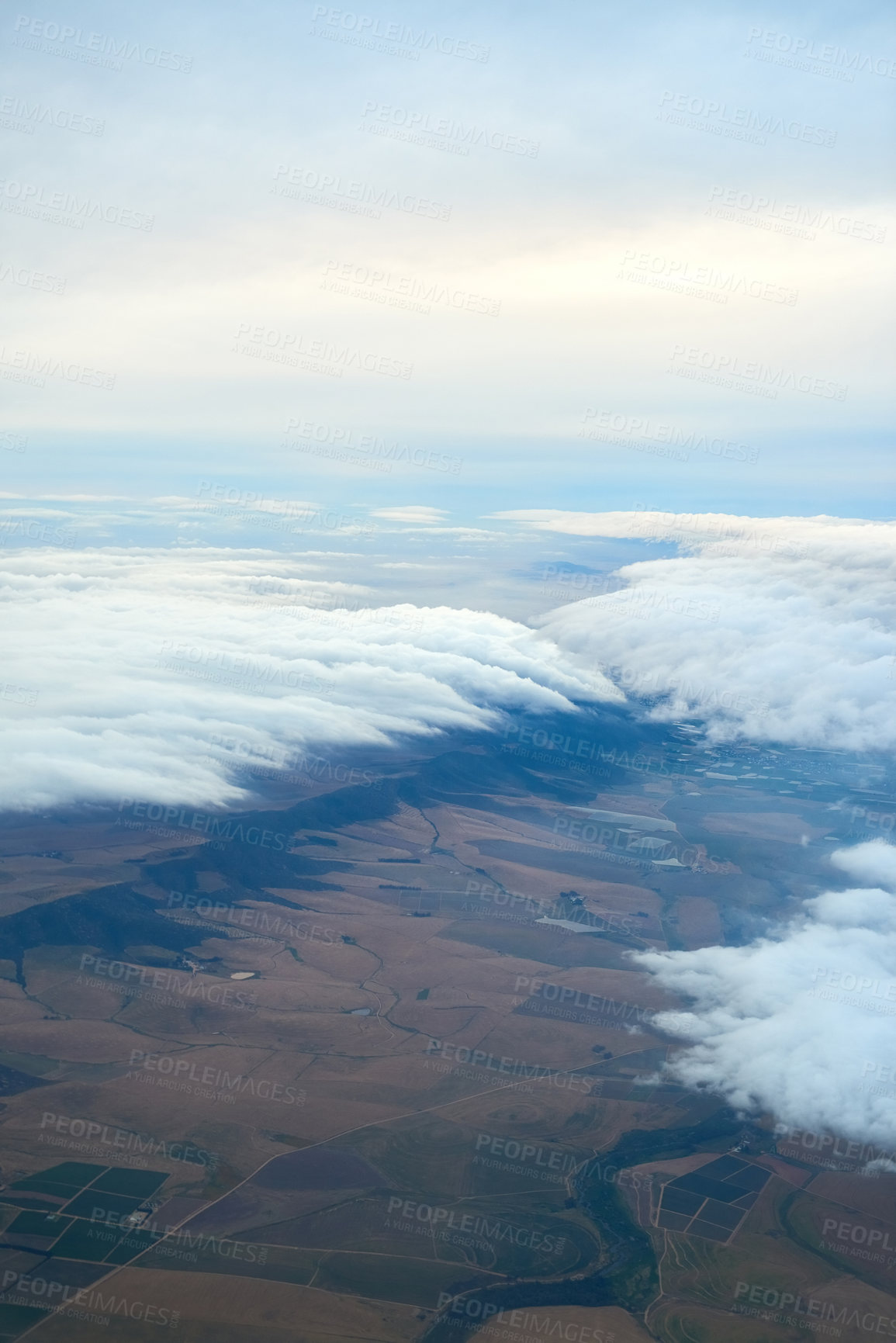 Buy stock photo Shot of a cloudy view seen from an airplane window