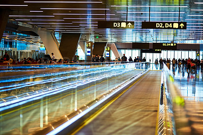 Buy stock photo Shot of moving walkways in a crowded airport waiting area