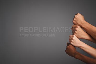 Buy stock photo Studio shot of unidentifiable hands making fists against a gray background
