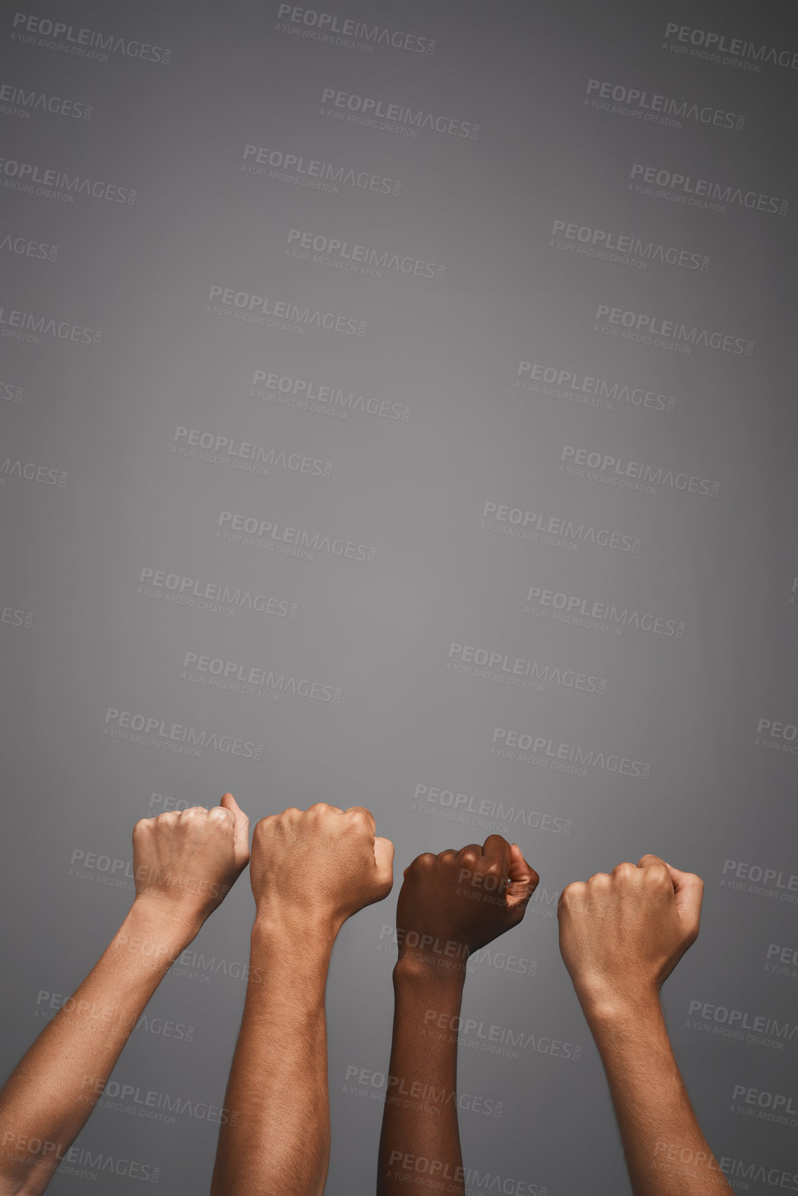 Buy stock photo Studio shot of unidentifiable hands making fists against a gray background