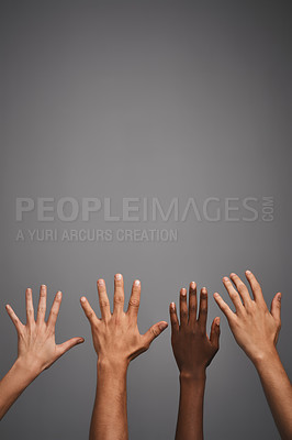 Buy stock photo Studio shot of unidentifiable hands reaching up towards blank copyspace