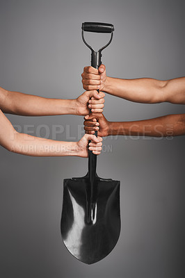 Buy stock photo Studio shot of unidentifiable hands holding on to a shovel against a gray background