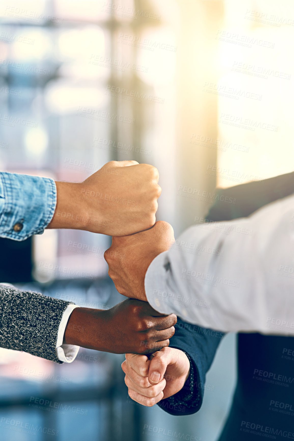 Buy stock photo Cropped shot of a group of unrecognizable businesspeople stacking fists