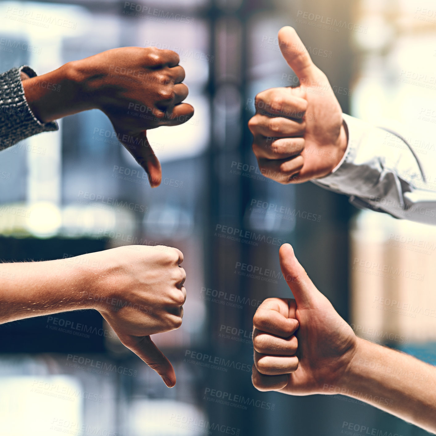 Buy stock photo Cropped shot of a group of unrecognizable businesspeople gesturing thumbs up and down