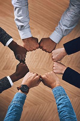 Buy stock photo Team building, fist bump or hands of business people for support, diversity or community group in office. Teamwork, above or circle of fists for motivation, collaboration or partnership for a mission