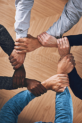 Buy stock photo Collaboration, holding or hands of business people with diversity for office support or teamwork. Zoom, link or above of group of employees with mission or team building for startup goals together 