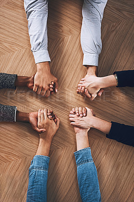 Buy stock photo Above, diversity or business people holding hands for support, team building or teamwork in office. Partnership, zoom or employees in group collaboration with solidarity or mission for goals together