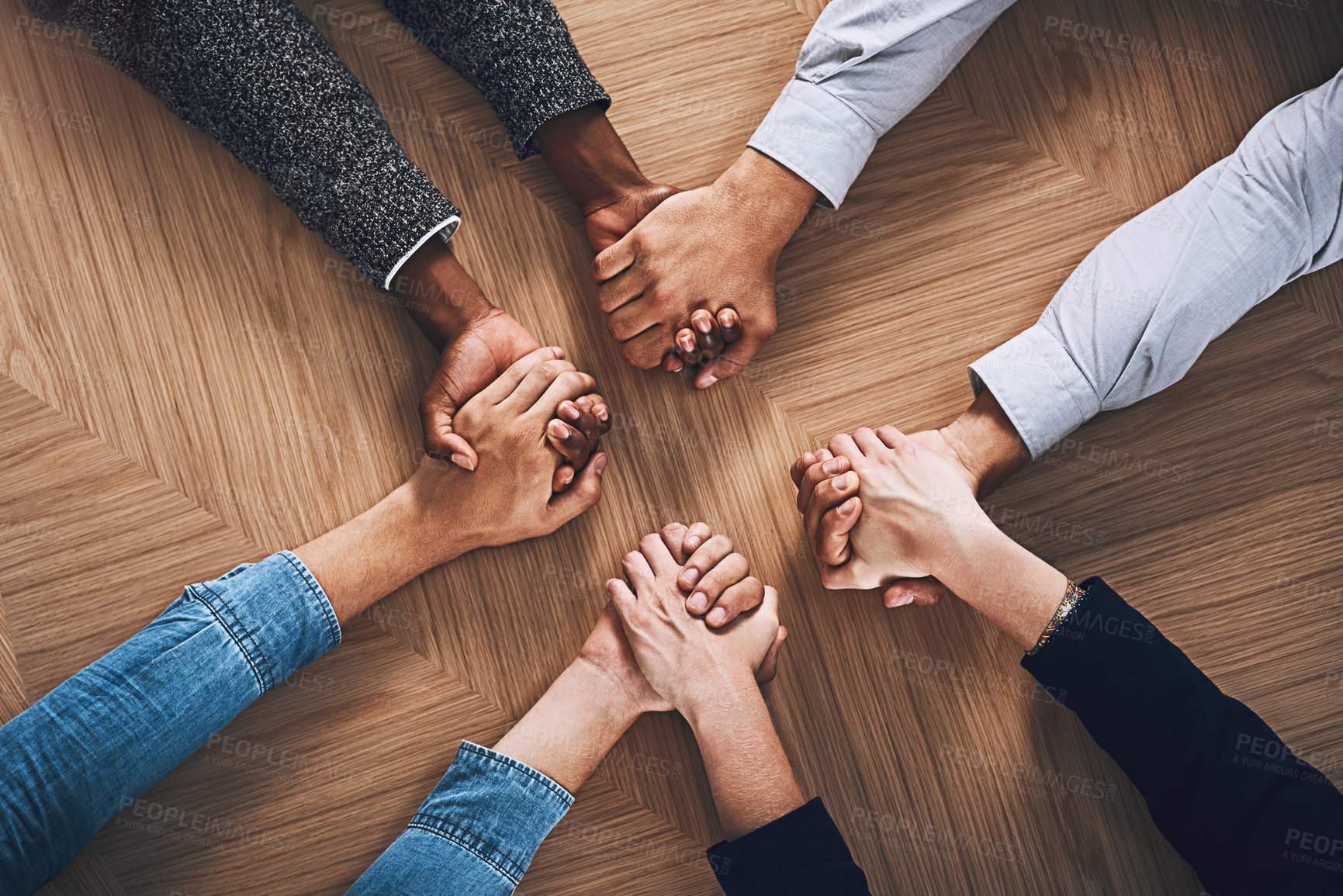 Buy stock photo Above, motivation or business people holding hands for support, team building or teamwork in office. Partnership, zoom or employees in group collaboration with diversity or mission for goals together