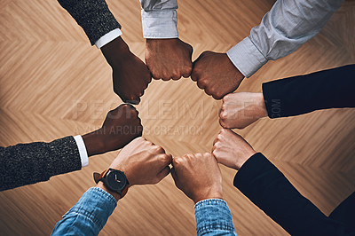 Buy stock photo Teamwork, fist bump or hands of business people for motivation, group support or community in office. Team building, above or circle of fists for diversity, collaboration or partnership mission 