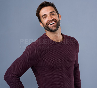 Buy stock photo Studio, laughing and portrait of man, fashion and confidence in mockup space, pride and jersey for winter. Blue background, funny and person in Miami, happy or comfortable in clothes, joy and sweater