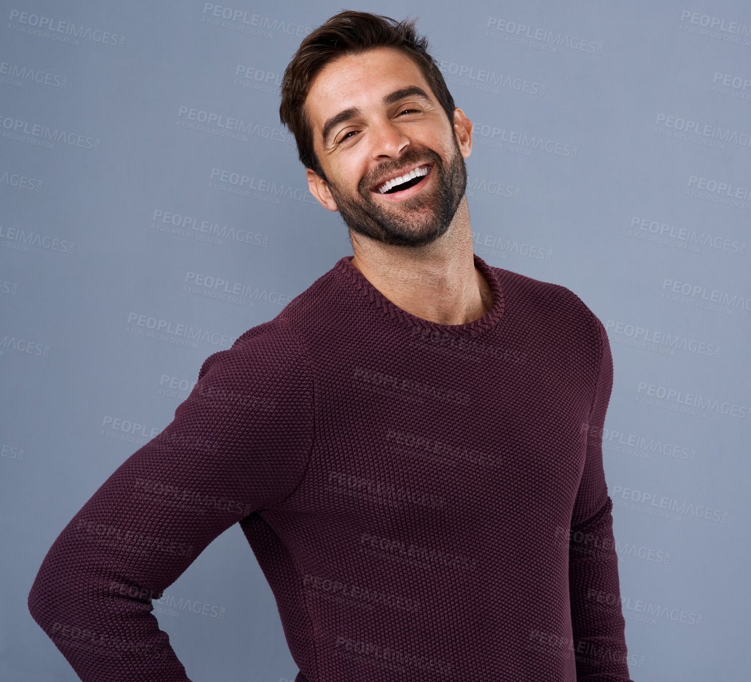 Buy stock photo Studio, laughing and portrait of man, fashion and confidence in mockup space, pride and jersey for winter. Blue background, funny and person in Miami, happy or comfortable in clothes, joy and sweater