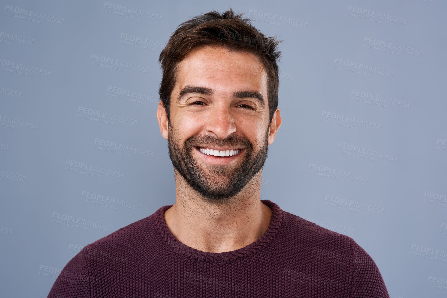 Buy stock photo Fashion, face and joy of man in studio, sweater and warm for winter in Canada, happy and discount. Blue background, portrait and smile of person, sale and cardigan of cotton, clothes and jersey