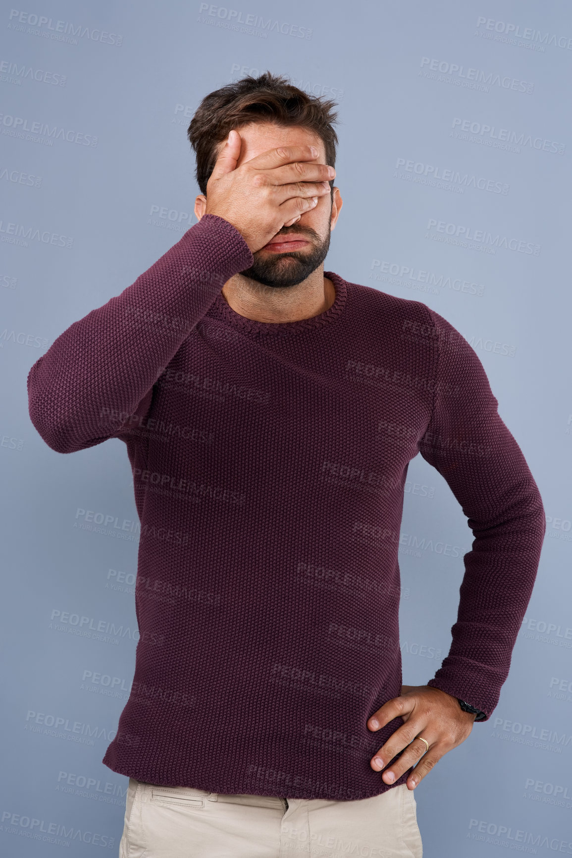 Buy stock photo Studio, cover and face of man, disappointed and thinking of memory, frustrated and anxiety with hand. Blue background, headache and depression for regret, shame and debt of student loans in USA