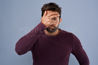 Buy stock photo Shame, man and cover of eye, portrait and disappointed of fail of party in elections and headache. Blue background, palm and hand to hide face, embarrassed and sad student in politics and unhappy