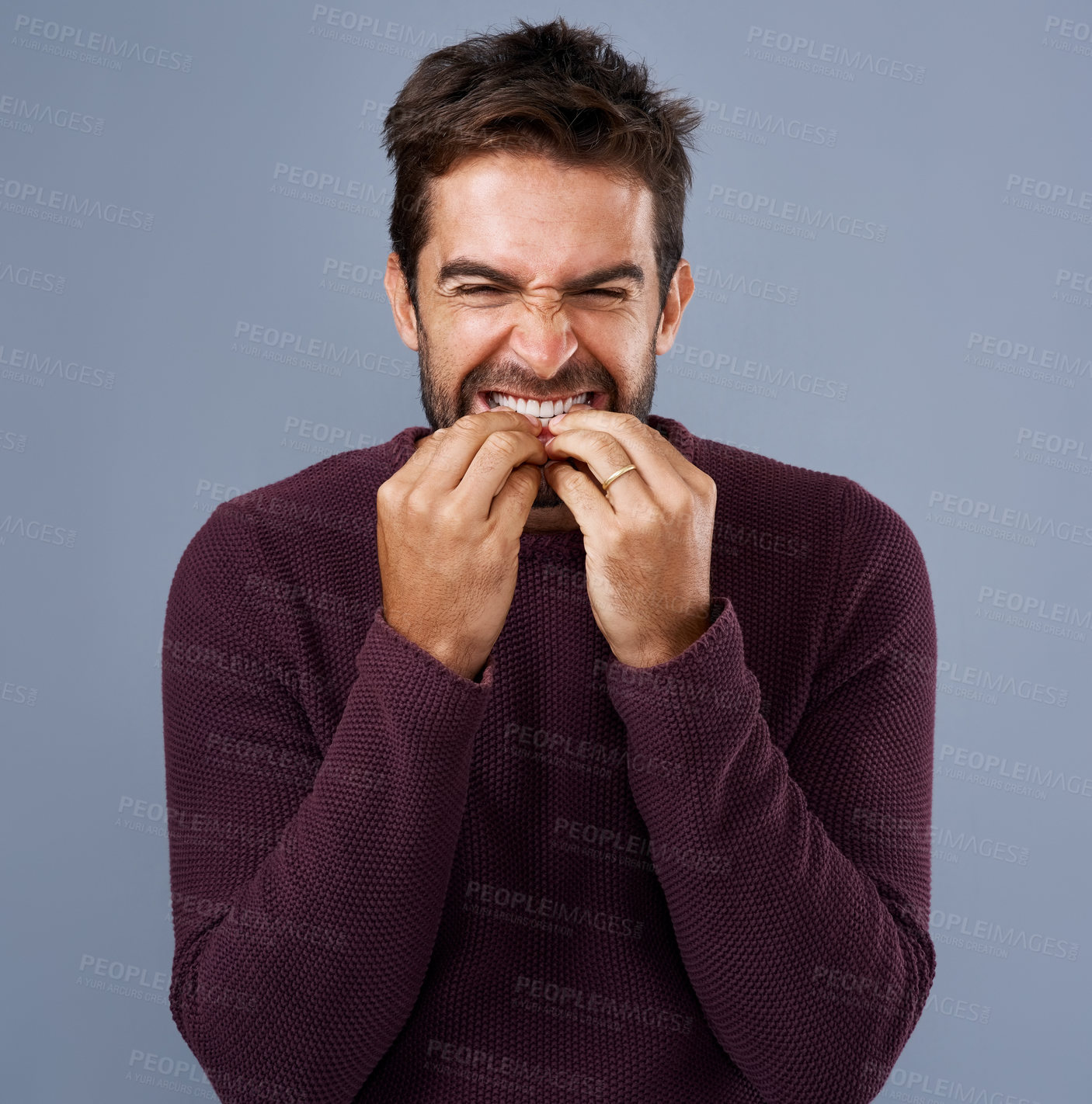 Buy stock photo Studio, scared and man bite nails or hands, thinking and anxiety for debt of student loans and stress. Blue background, fear and person with teeth to chew, frustrated and nervous of college in USA