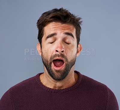 Buy stock photo Tired, yawn and man in studio for fatigue or low energy against a grey background. Exhausted, yawning and face of bored male sleepy, lazy or suffering from insomnia, problem or burnout with emoji