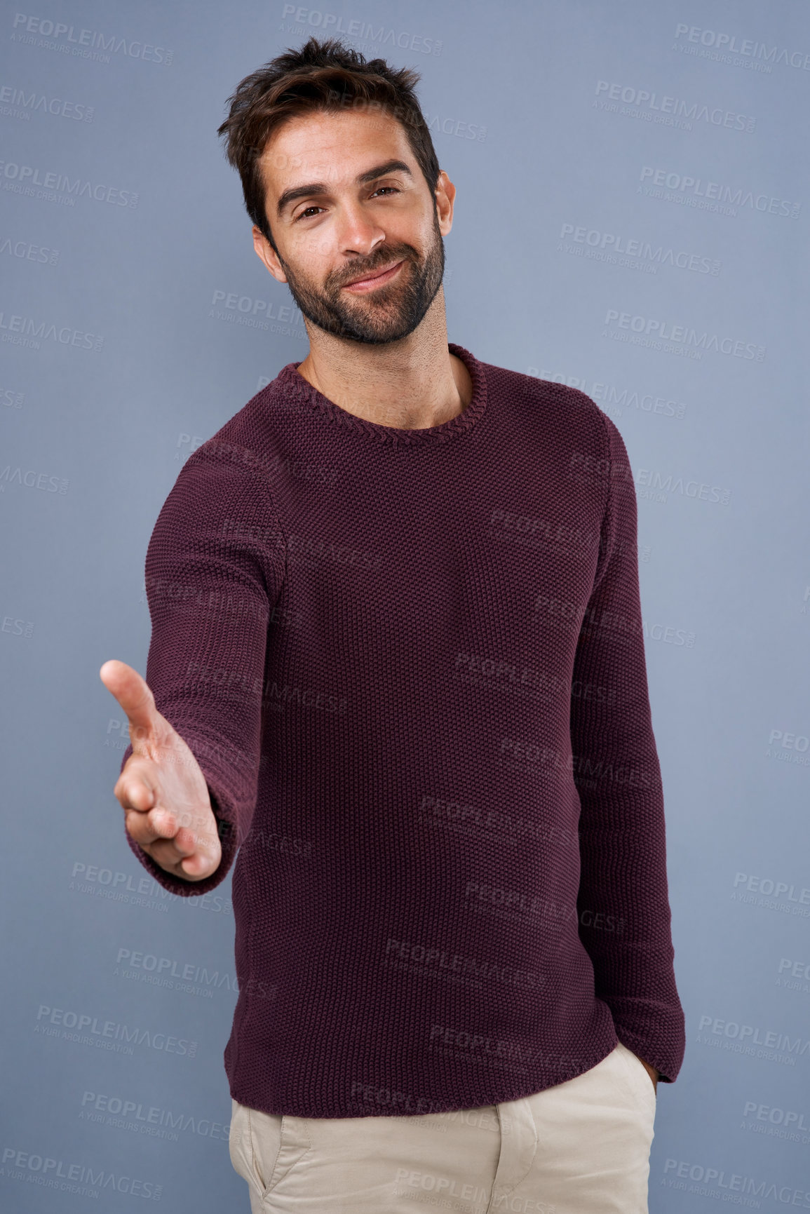 Buy stock photo Happy man, portrait and handshake with greeting for introduction or meeting on a studio background. Male person or young model with smile for shaking hands, welcome or thank you for deal or agreement