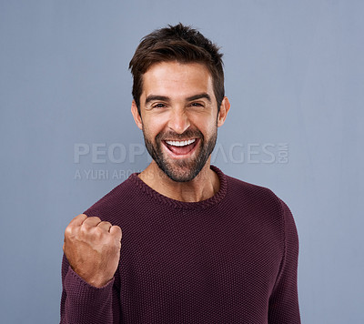 Buy stock photo Success, fist and happy man on studio background with celebration, achievement or yes for bonus, competition or lottery. Excited winner in portrait with power and motivation for news or opportunity