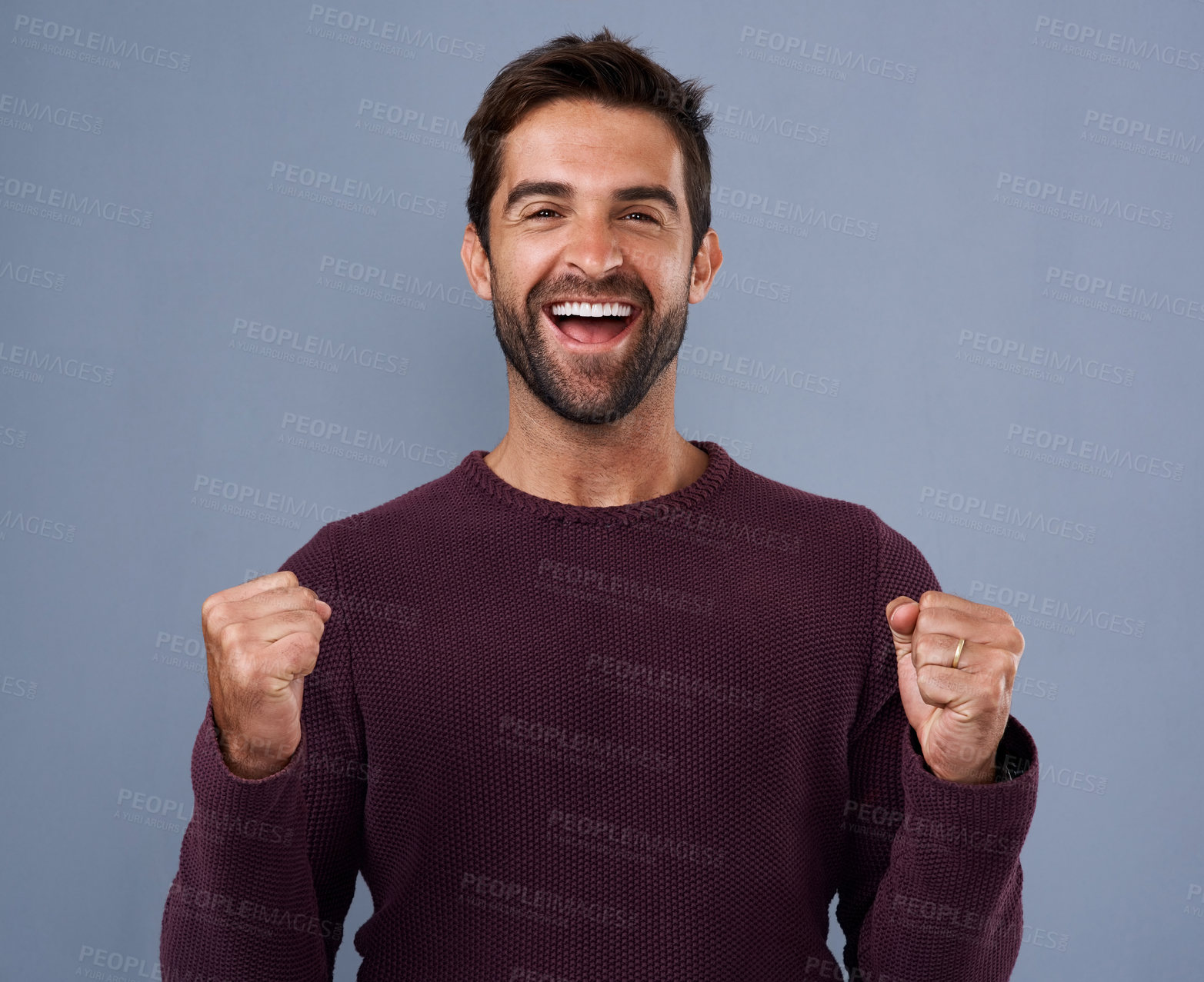 Buy stock photo Portrait, fist and happy man in studio with celebration for achievement, target or reaching goal on blue background. Excited, scream and male person for success, victory or lotto winner on mockup