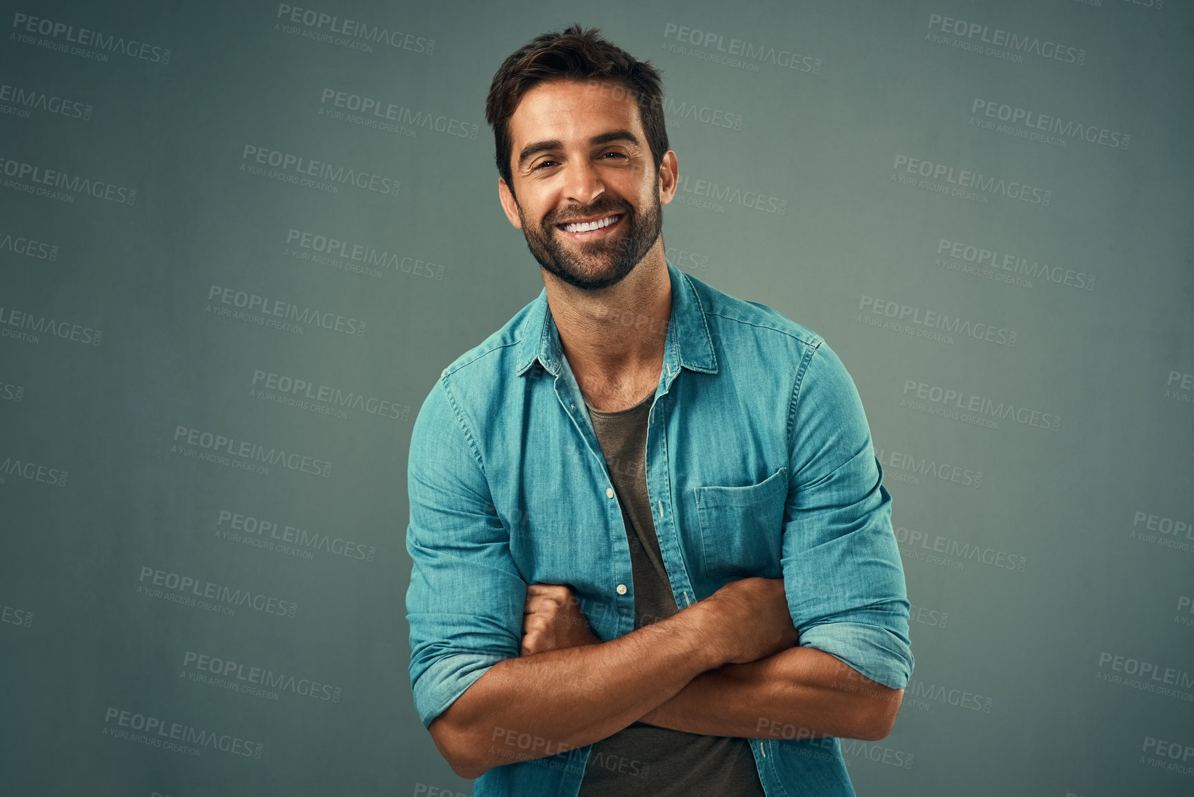 Buy stock photo Arms crossed, fashion and happy with portrait of man in studio on gray background for relaxed clothing style. Casual, confident and natural with smile of person in outfit to model clothes or shirt