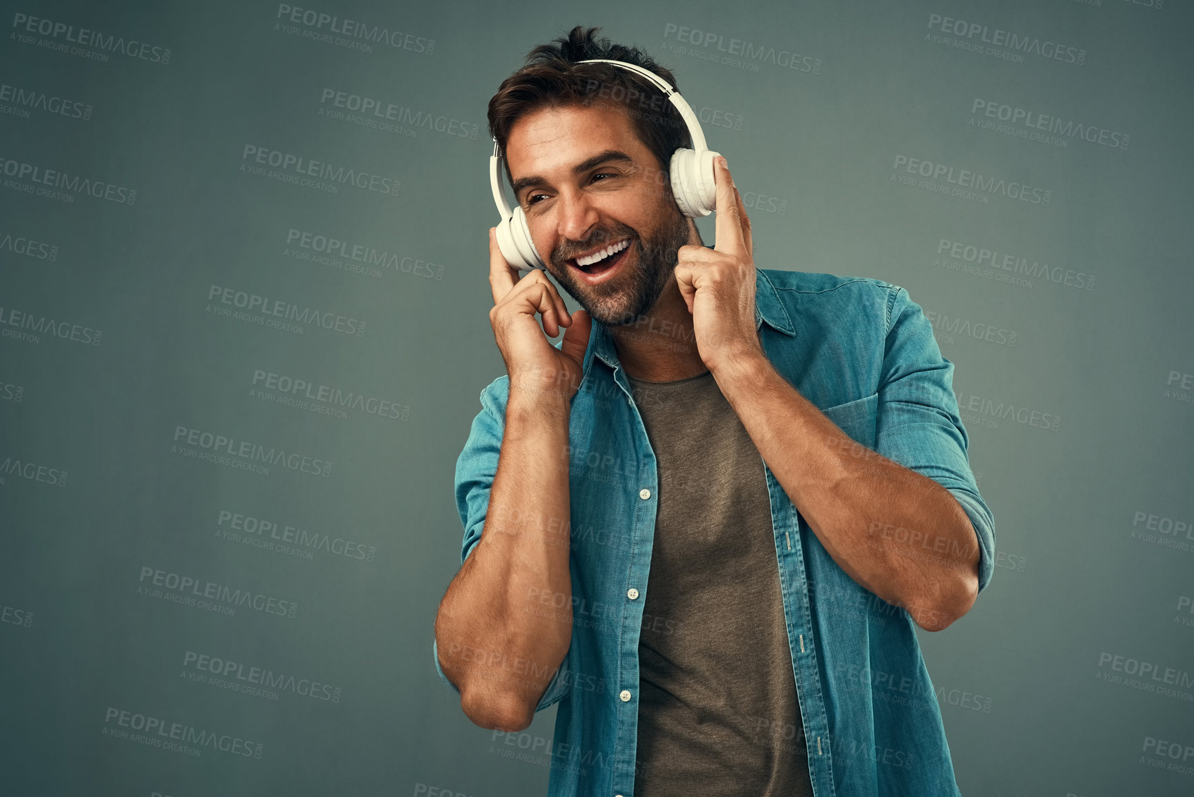 Buy stock photo Smile, man and headphone for music in studio, audio media and podcast or ebook on gray background. Technology, streaming and online subscription for song, happy and listening person with mockup