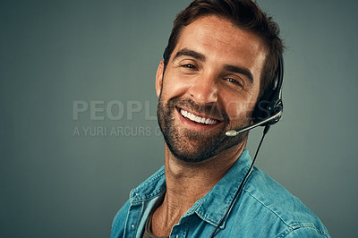 Buy stock photo Happy man, portrait and headphones for call center consulting against a grey studio background. Face of friendly male consultant agent with smile and headset in contact us for help or online advice