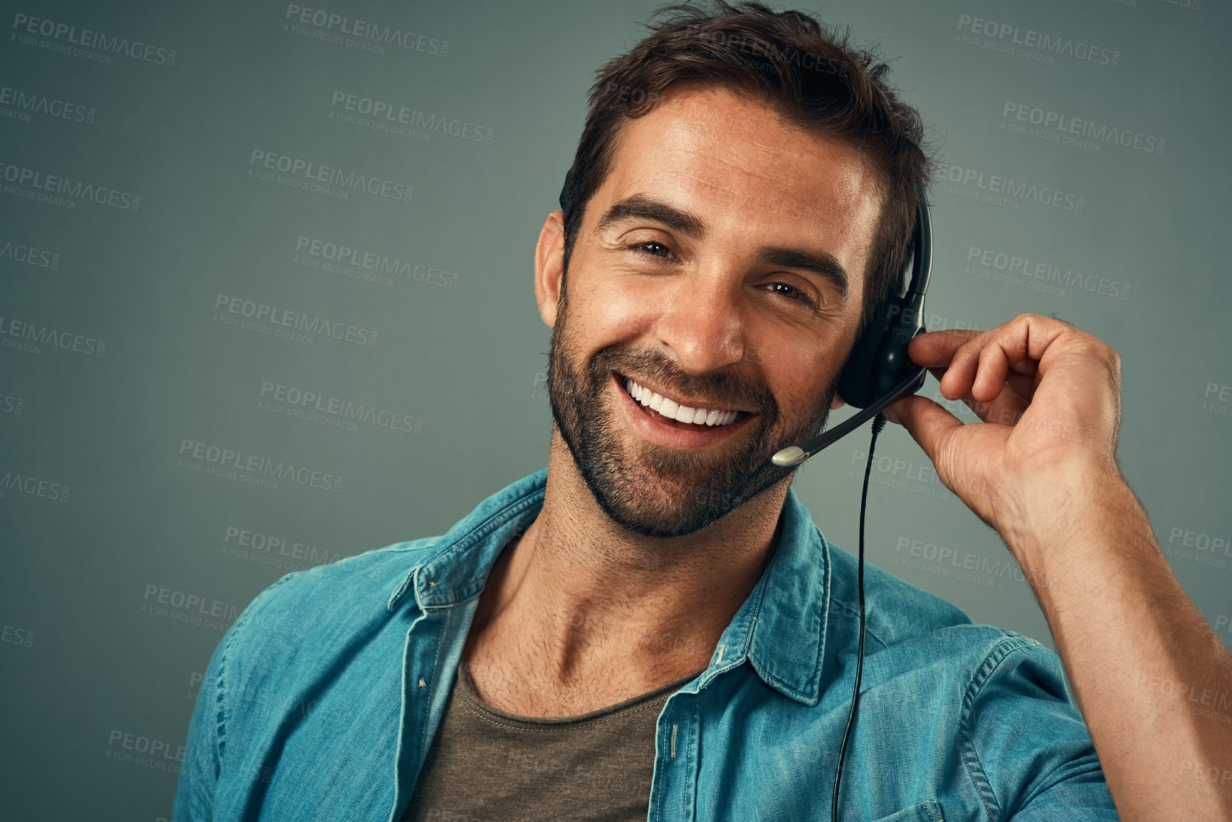 Buy stock photo Happy man, headphones and portrait of call center consultant against a grey studio background. Face of friendly male consulting agent with smile and headset in contact us for help or online advice