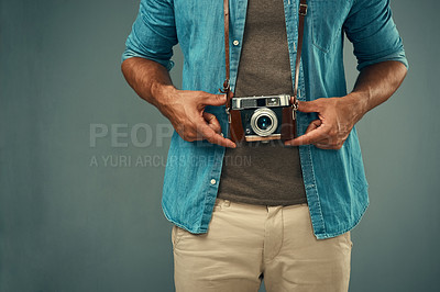 Buy stock photo Hands, vintage camera and man as photographer in studio for photoshoot, creativity and memory. Mockup, male journalist and film equipment for photography, production and lens focus by gray background