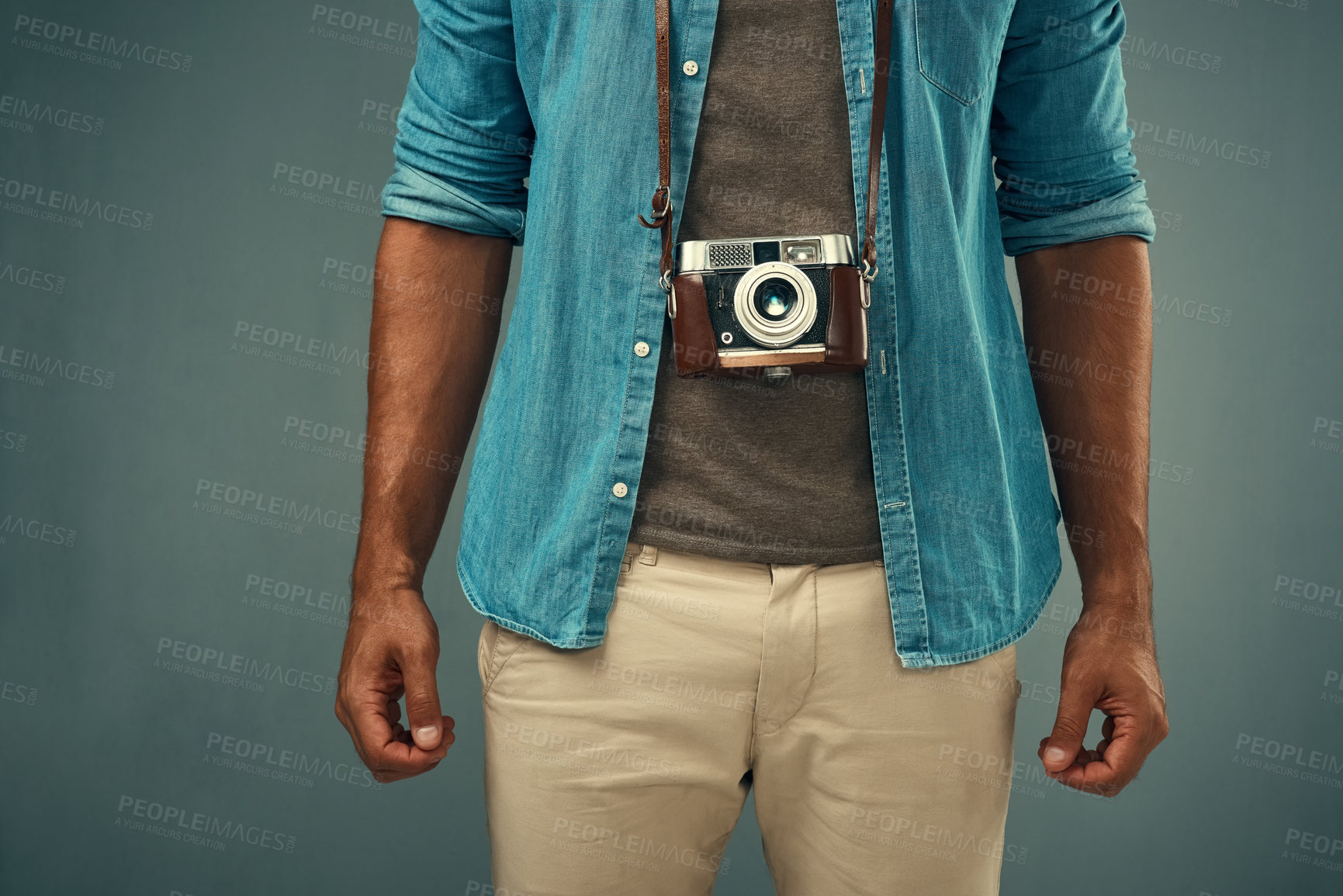 Buy stock photo Capture, camera and man as photographer in studio for tourist blog, creativity and memory. Mockup, male journalist and film equipment for photography, production and lens focus by gray background