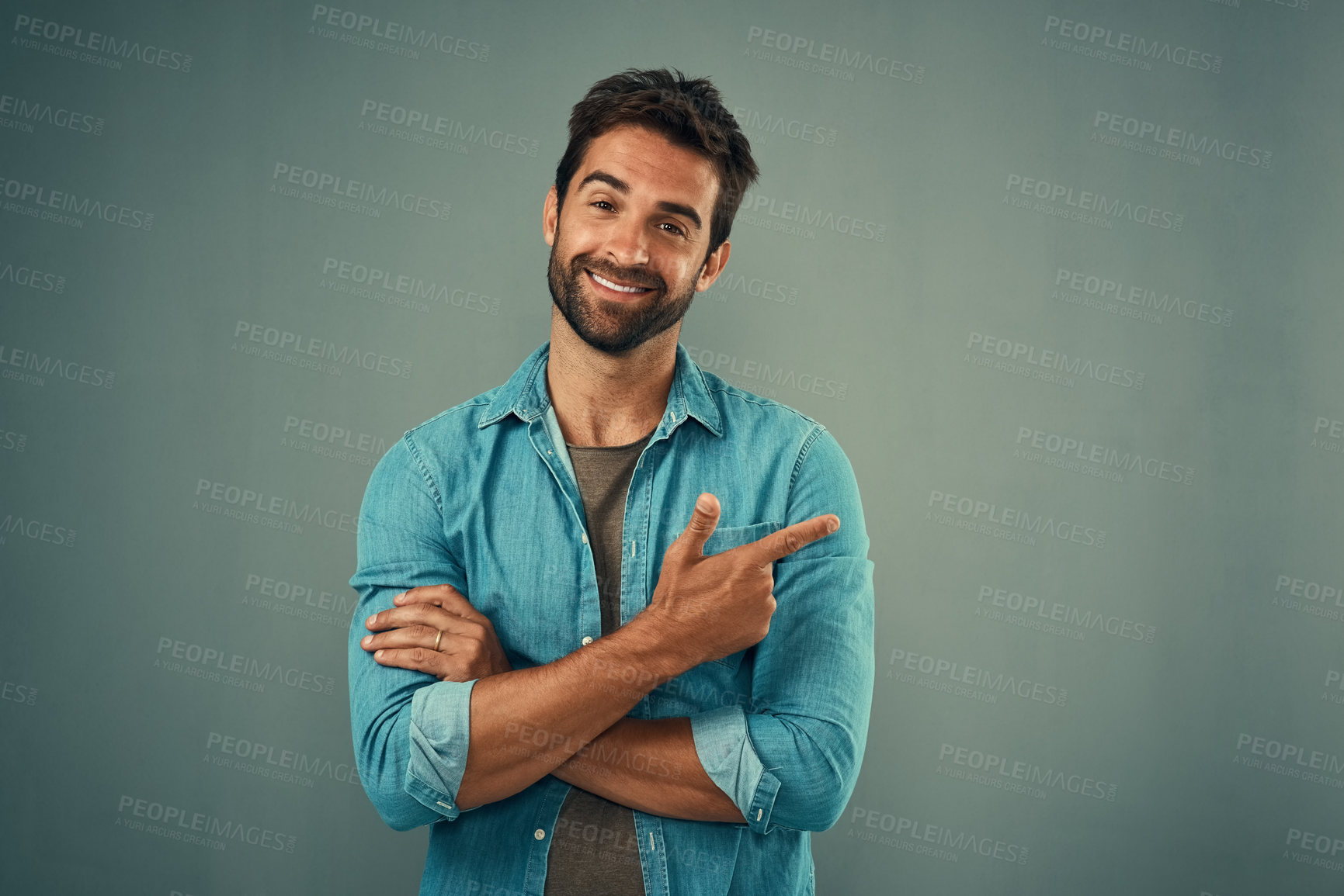 Buy stock photo Point, happy and portrait of man in studio on gray background for announcement, news and information. Fashion, mockup space and male person with pointing hand sign for promotion, choice and decision